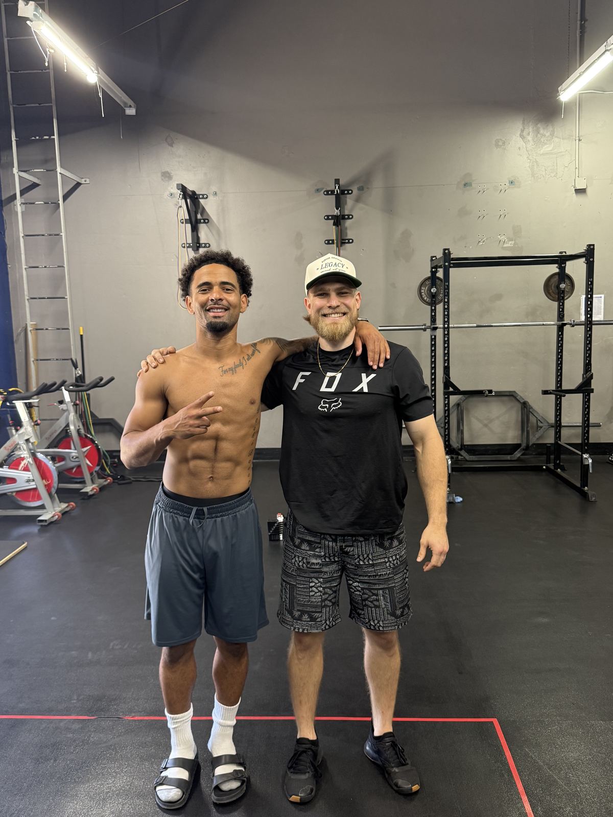 Coach Francis with pro basketball player Kyree B.