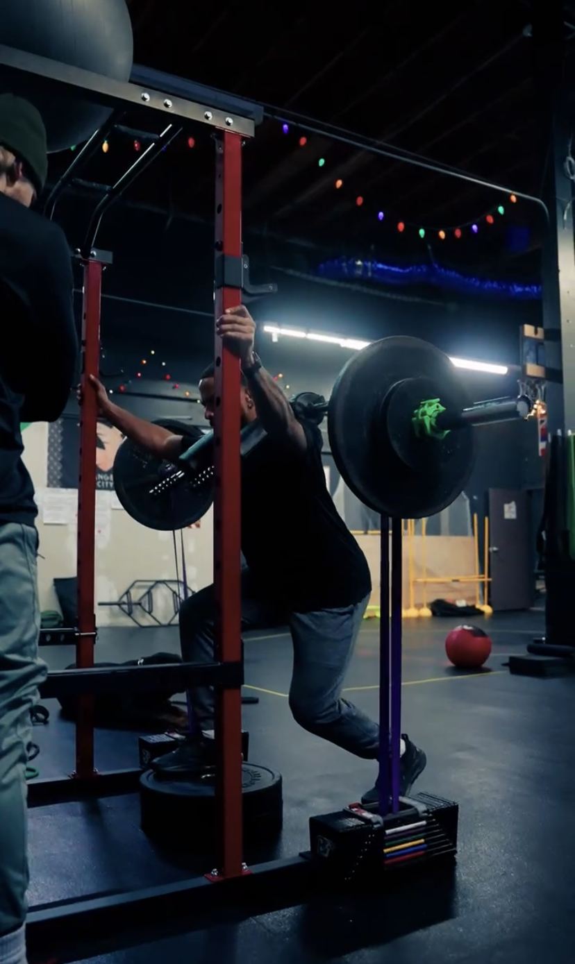 Pro basketball player doing a loaded split squat